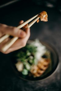 Chopsticks take a little practice to master, but enhance your meal once you know how to use them.